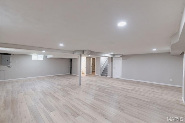 7315 Cheshire Ln, Affton, MO 63123 - basement with stairs, electric panel, light wood-style floors, and recessed lighting