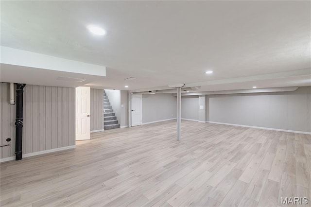 7315 Cheshire Ln, Affton, MO 63123 - finished basement featuring stairs, light wood finished floors, and recessed lighting