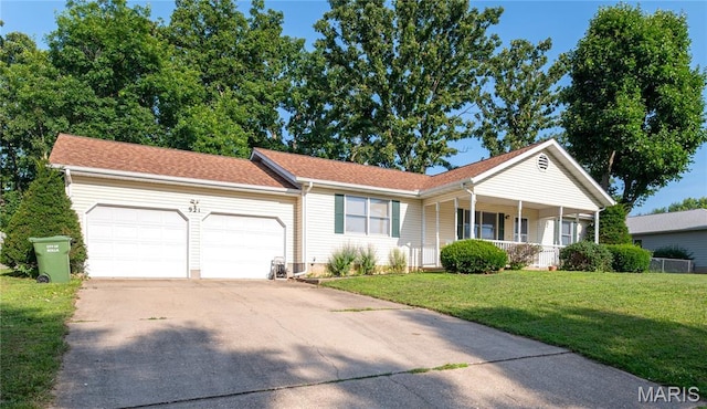 921 Mallard Sq, Rolla, MO 65401 - ranch-style home with a garage, concrete driveway, a front yard, and covered porch