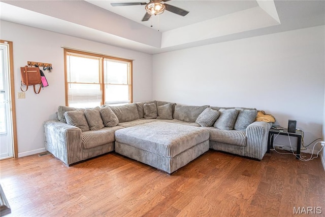 921 Mallard Sq, Rolla, MO 65401 - living area featuring ceiling fan, light wood-style flooring, and a raised ceiling
