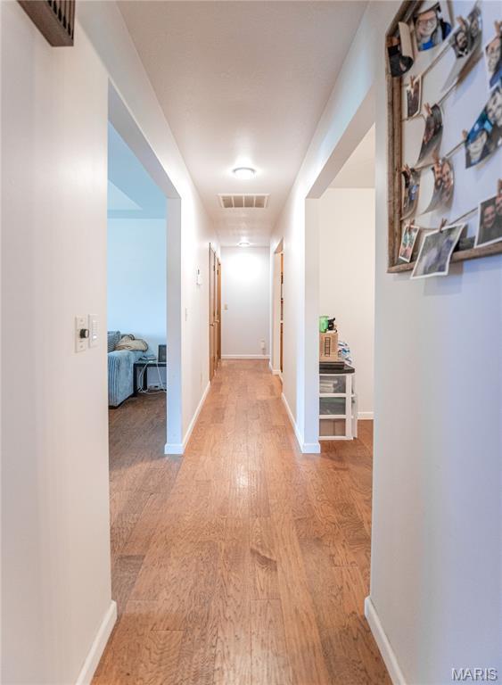 921 Mallard Sq, Rolla, MO 65401 - hall with wood finished floors and baseboards