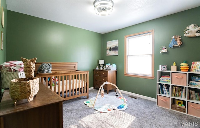 921 Mallard Sq, Rolla, MO 65401 - bedroom with carpet flooring and a crib