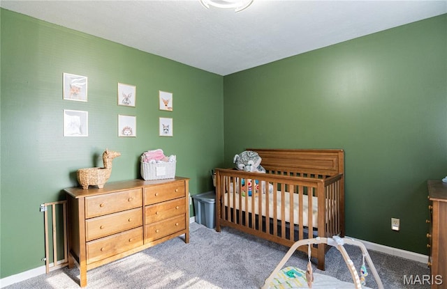921 Mallard Sq, Rolla, MO 65401 - carpeted bedroom featuring baseboards and a nursery area