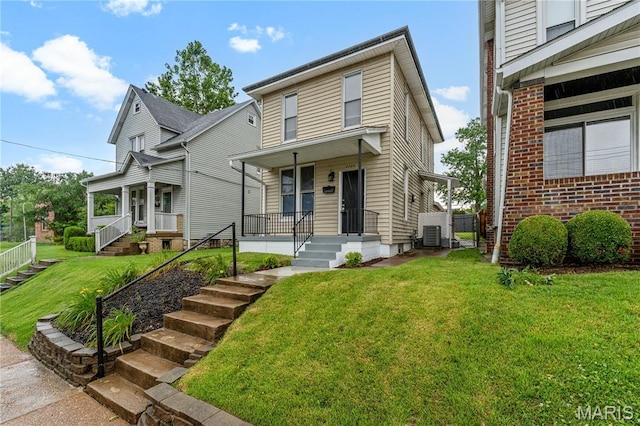 2725 Macklind Ave, Saint Louis, MO 63139 - view of front facade featuring covered porch and a front yard