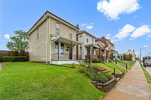 2725 Macklind Ave, Saint Louis, MO 63139 - rear view of property featuring a residential view and covered porch