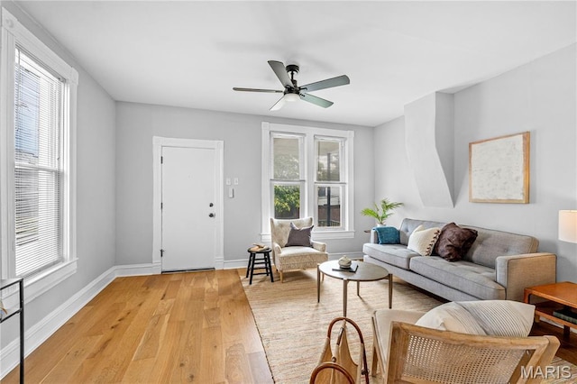 2725 Macklind Ave, Saint Louis, MO 63139 - living area with light wood-type flooring, healthy amount of natural light, and ceiling fan