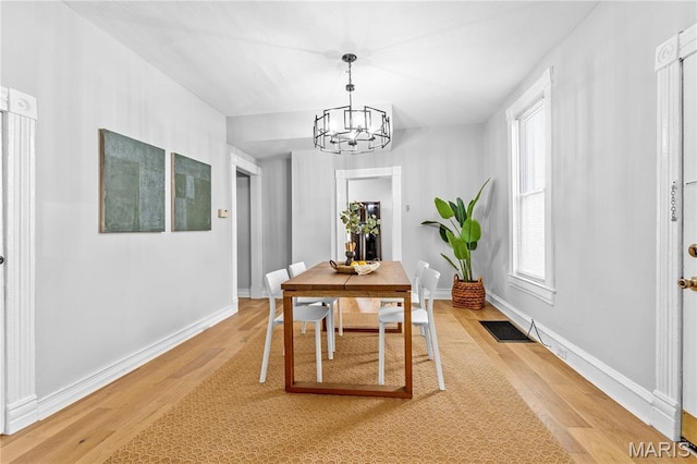 2725 Macklind Ave, Saint Louis, MO 63139 - dining space with a chandelier and light wood finished floors