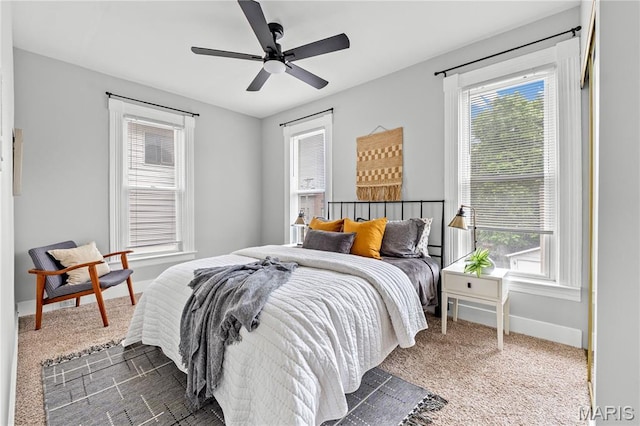 2725 Macklind Ave, Saint Louis, MO 63139 - carpeted bedroom with multiple windows and a ceiling fan