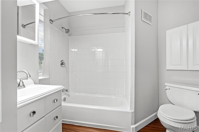 2725 Macklind Ave, Saint Louis, MO 63139 - full bath with vanity, washtub / shower combination, and wood finished floors
