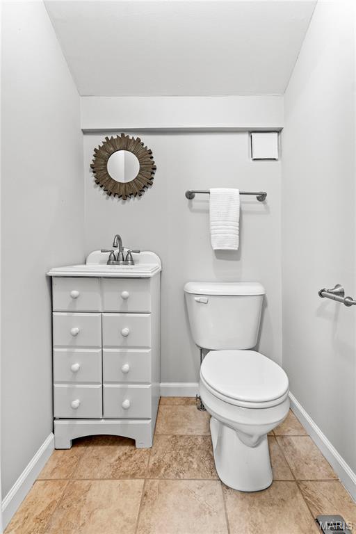 2725 Macklind Ave, Saint Louis, MO 63139 - half bathroom with toilet and vanity