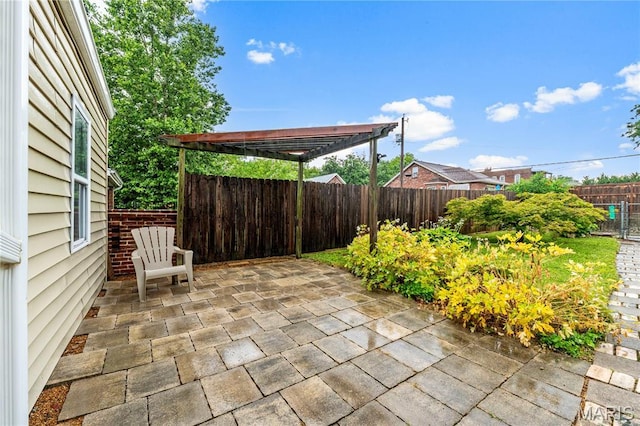 2725 Macklind Ave, Saint Louis, MO 63139 - fenced backyard featuring a patio area and a pergola