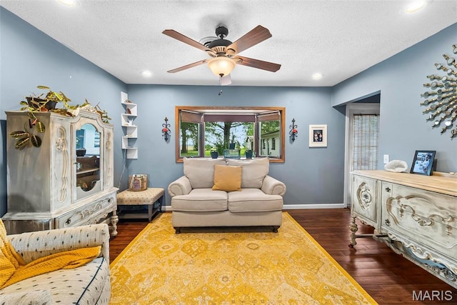 8114 Montclaire Ave, Brighton, IL 62012 - living room with dark wood-style flooring, ceiling fan, recessed lighting, and a textured ceiling