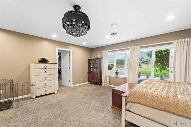 8114 Montclaire Ave, Brighton, IL 62012 - bedroom with light carpet, recessed lighting, a chandelier, and a walk in closet