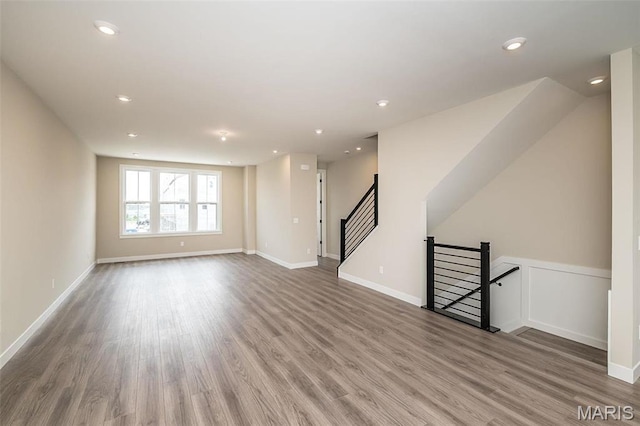 1347 W Gateway Hts W Unit 53-603, Richmond Heights, MO 63144 - unfurnished living room with wood finished floors and recessed lighting