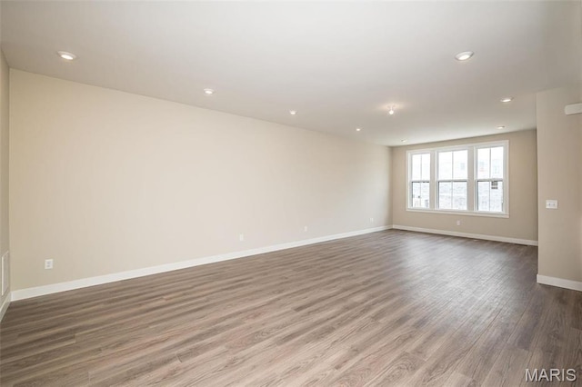 1347 W Gateway Hts W Unit 53-603, Richmond Heights, MO 63144 - unfurnished room with wood finished floors and recessed lighting