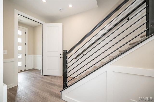 1347 W Gateway Hts W Unit 53-603, Richmond Heights, MO 63144 - staircase featuring wood finished floors, recessed lighting, and a wainscoted wall