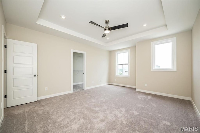 1347 W Gateway Hts W Unit 53-603, Richmond Heights, MO 63144 - unfurnished bedroom with a raised ceiling, carpet flooring, a walk in closet, recessed lighting, and ceiling fan