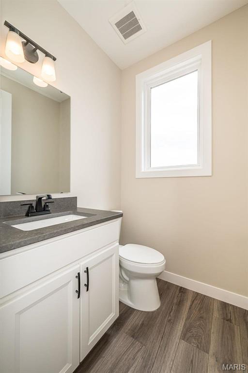 1347 W Gateway Hts W Unit 53-603, Richmond Heights, MO 63144 - bathroom with vanity and wood finished floors