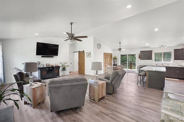 8224 Wild Acre Meadows Dr, Hillsboro, MO 63050 - living room featuring ceiling fan, a barn door, light wood-type flooring, recessed lighting, and high vaulted ceiling