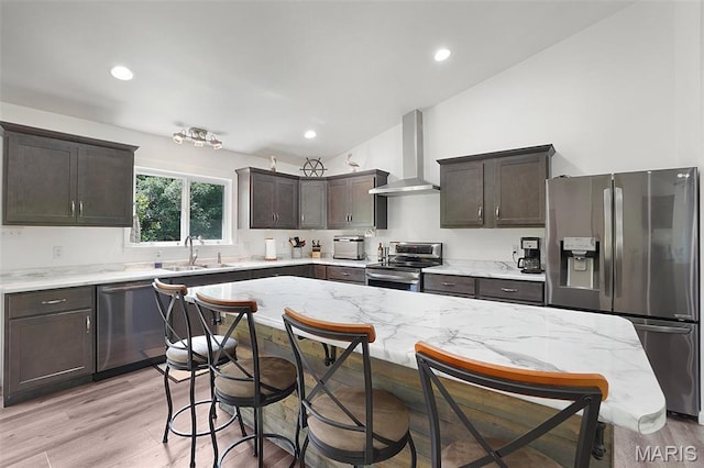 8224 Wild Acre Meadows Dr, Hillsboro, MO 63050 - kitchen with appliances with stainless steel finishes, range hood, dark brown cabinets, a breakfast bar, and vaulted ceiling