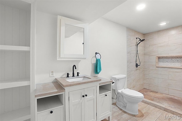 8224 Wild Acre Meadows Dr, Hillsboro, MO 63050 - bathroom with vanity, a tile shower, and wood finished floors