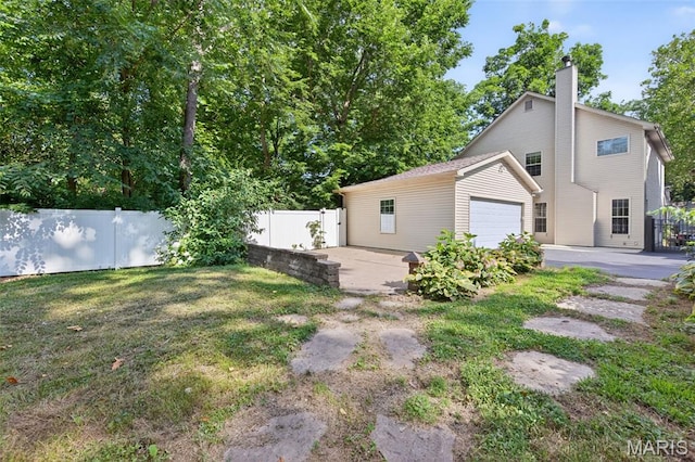 432 Clark Ave, Webster Groves, MO 63119 - rear view of property with a chimney and a garage