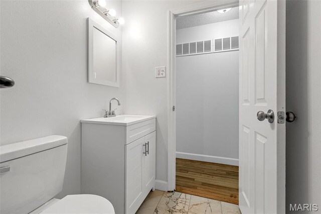 2315 Bramble Ln, Florissant, MO 63033 - half bathroom with vanity and marble finish flooring