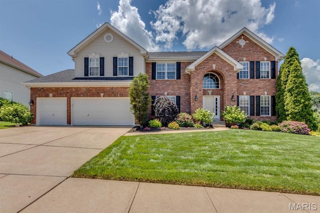 3026 Windsor Point Dr, Saint Louis, MO 63129 - view of front facade with brick siding, a front lawn, driveway, and an attached garage