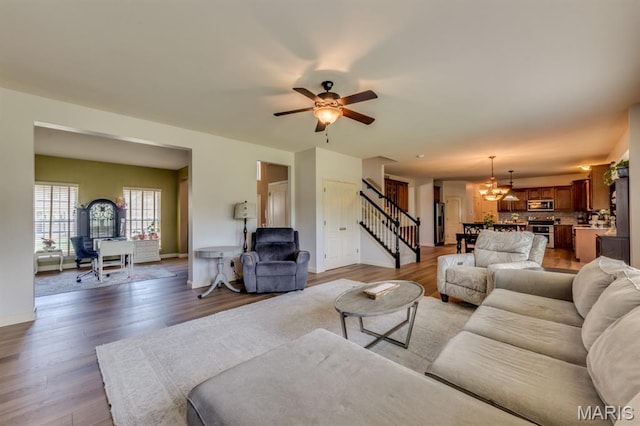 3026 Windsor Point Dr, Saint Louis, MO 63129 - living room with stairs, a chandelier, and light wood finished floors