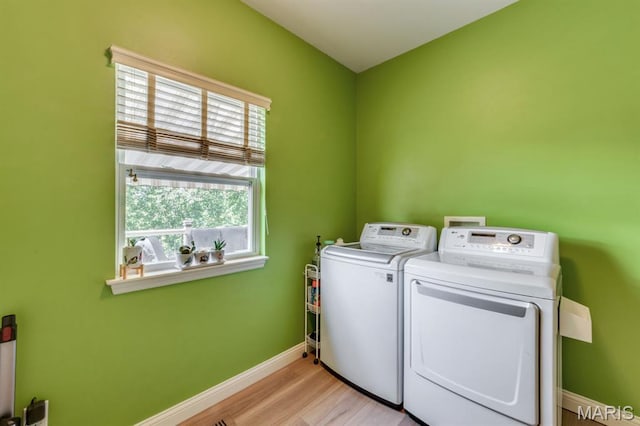3026 Windsor Point Dr, Saint Louis, MO 63129 - laundry room featuring washing machine and dryer and light wood-type flooring