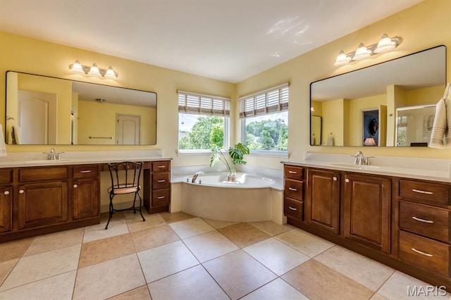 3026 Windsor Point Dr, Saint Louis, MO 63129 - full bath featuring two vanities, a garden tub, a stall shower, and tile patterned floors