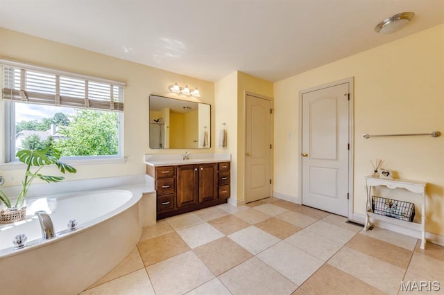 3026 Windsor Point Dr, Saint Louis, MO 63129 - bathroom with vanity, a garden tub, and tile patterned flooring