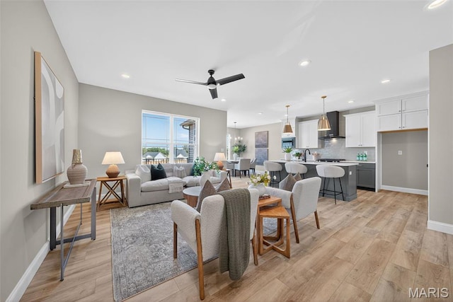 554 Wheatfield Cir, Ofallon, MO 63385 - living room featuring ceiling fan, recessed lighting, and light wood-style floors