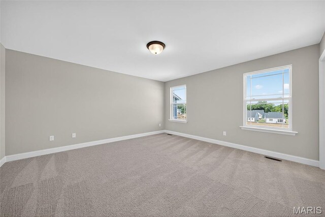 554 Wheatfield Cir, Ofallon, MO 63385 - carpeted spare room with baseboards