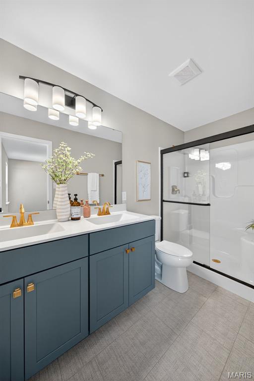 554 Wheatfield Cir, Ofallon, MO 63385 - full bath with double vanity and a shower stall