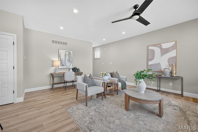 554 Wheatfield Cir, Ofallon, MO 63385 - living area with wood finished floors, ceiling fan, and recessed lighting