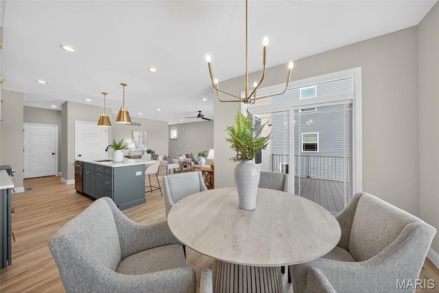 554 Wheatfield Cir, Ofallon, MO 63385 - dining space featuring a ceiling fan, light wood-style flooring, and recessed lighting