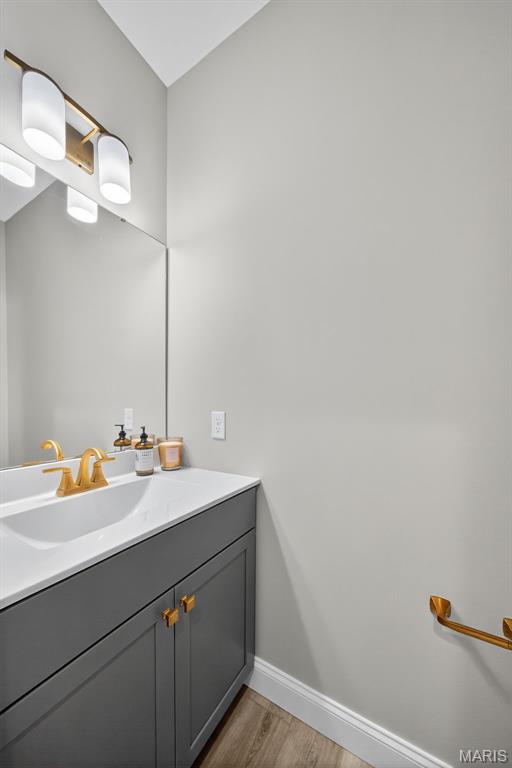 554 Wheatfield Cir, Ofallon, MO 63385 - bathroom with wood finished floors and vanity