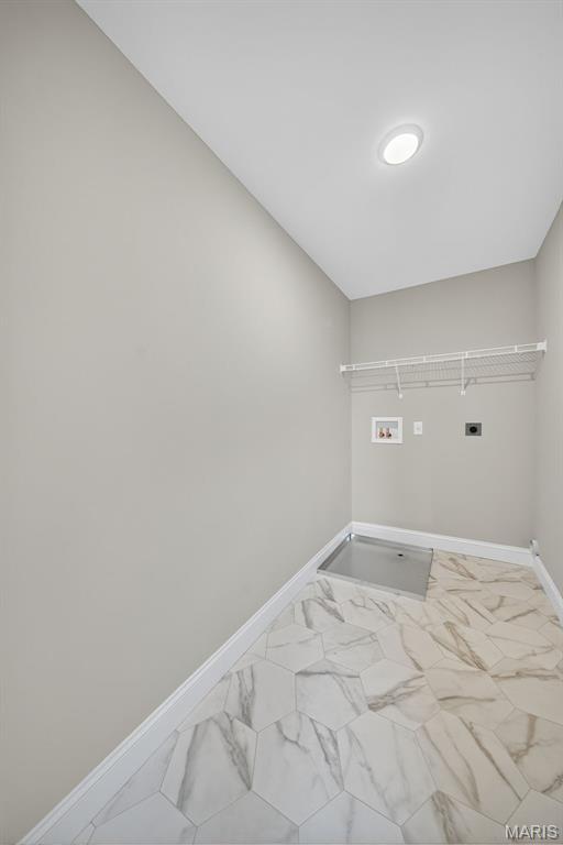 554 Wheatfield Cir, Ofallon, MO 63385 - laundry area featuring electric dryer hookup, hookup for a washing machine, and marble finish flooring