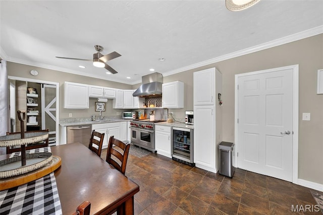 11365 Inverness Ln, Maryland Heights, MO 63043 - kitchen with beverage cooler, wall chimney range hood, appliances with stainless steel finishes, light countertops, and crown molding
