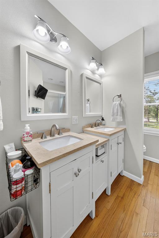 11365 Inverness Ln, Maryland Heights, MO 63043 - full bath with double vanity and wood finished floors