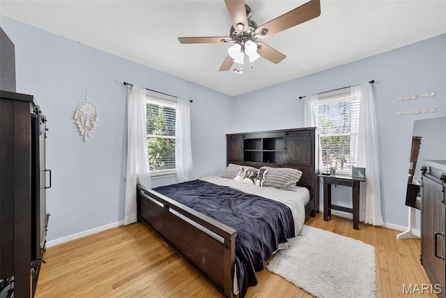 11365 Inverness Ln, Maryland Heights, MO 63043 - bedroom featuring light wood-type flooring and a ceiling fan