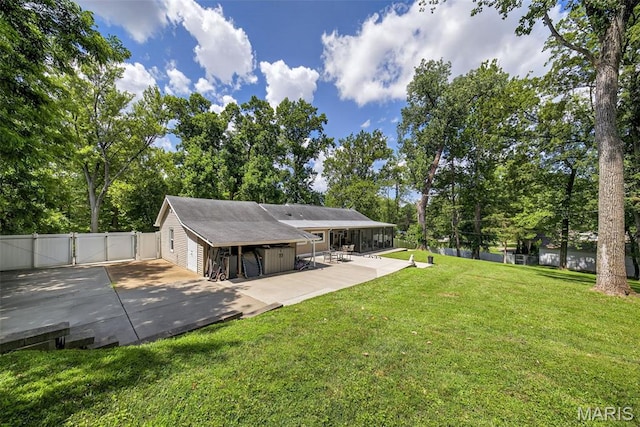 11365 Inverness Ln, Maryland Heights, MO 63043 - rear view of house with a gate, a patio area, and view of scattered trees