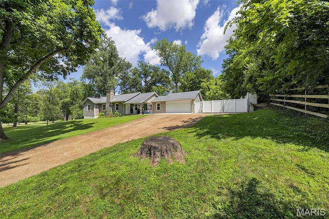 11365 Inverness Ln, Maryland Heights, MO 63043 - ranch-style home featuring concrete driveway, an attached garage, and a chimney