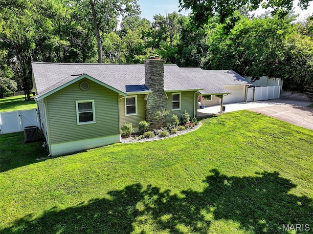 11365 Inverness Ln, Maryland Heights, MO 63043 - single story home with concrete driveway, a garage, a chimney, a shingled roof, and view of wooded area