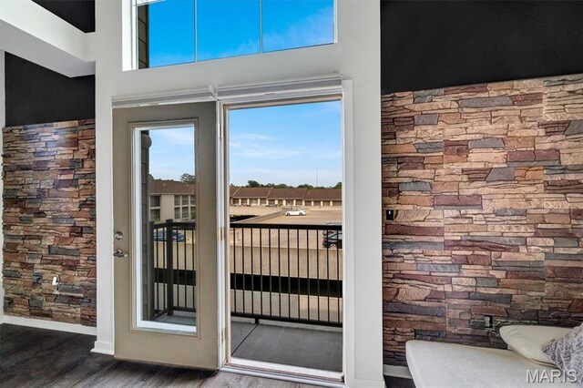 200 S Kirkwood Rd Unit 317, Kirkwood, MO 63122 - doorway to outside featuring wood finished floors and baseboards