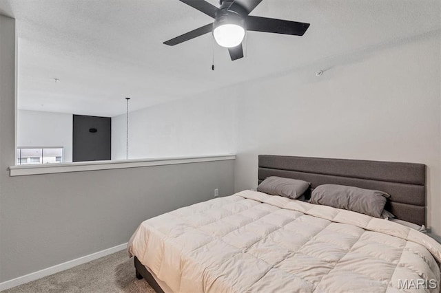 200 S Kirkwood Rd Unit 317, Kirkwood, MO 63122 - carpeted bedroom with baseboards and a ceiling fan