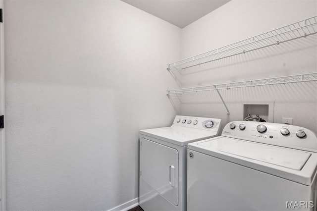 200 S Kirkwood Rd Unit 317, Kirkwood, MO 63122 - laundry room featuring washer and clothes dryer and baseboards