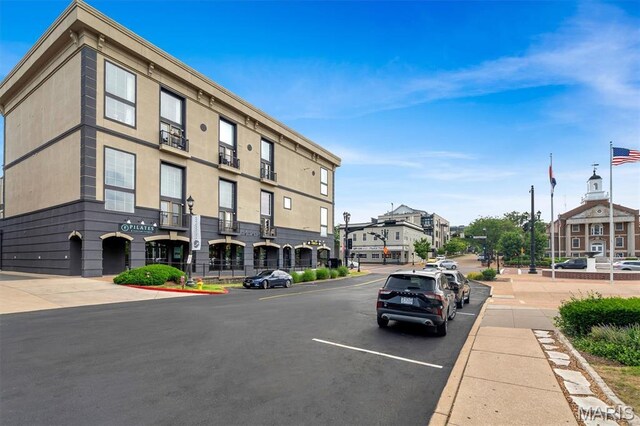 200 S Kirkwood Rd Unit 317, Kirkwood, MO 63122 - view of asphalt street with street lights, sidewalks, and curbs