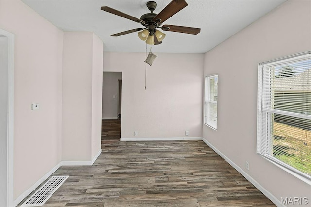 208 Washington Ave, East Alton, IL 62024 - spare room featuring healthy amount of natural light, wood finished floors, and a ceiling fan